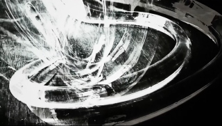 An abstract black-and-white digital image where white marks make a downwards swirling motion not unlike a whirlpool.
