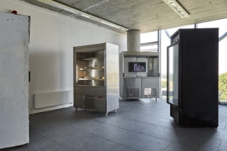 Spoiled Spores 2019, 27-30 cheese wheels, 4 commercial chillers/fridges, 32" TV, 4K film, duration 9 minutes