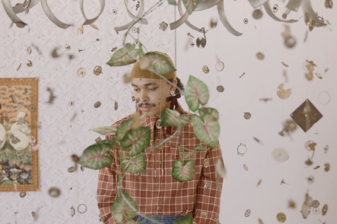 Gustav Parker Hibbett at the exhibition 'Better a bare foot than none'. Film still by Ros Kavanagh.