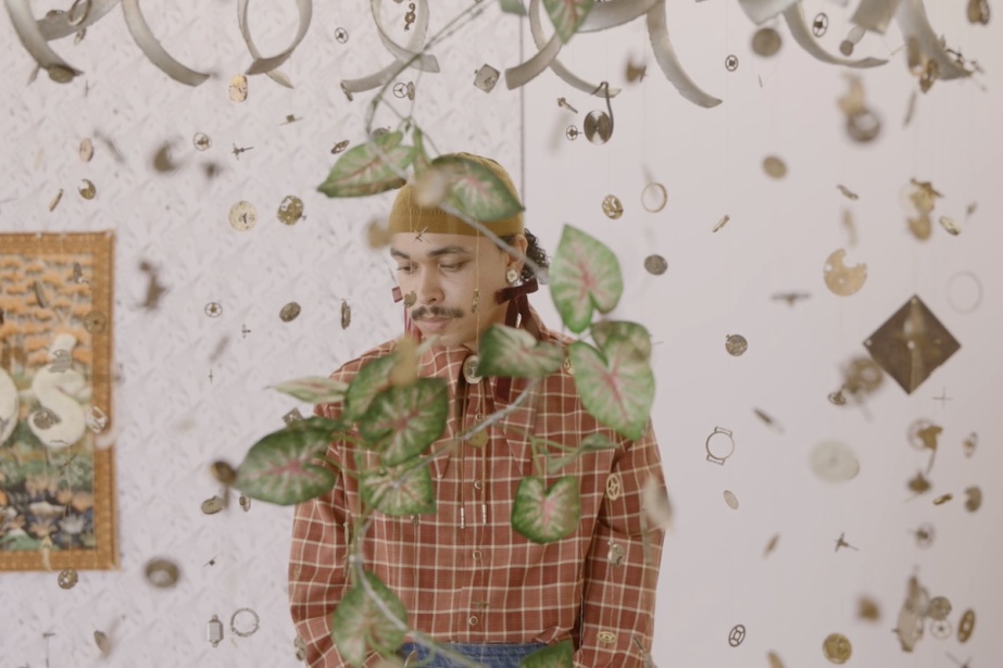 Gustav Parker Hibbett at the exhibition 'Better a bare foot than none'. Film still by Ros Kavanagh.