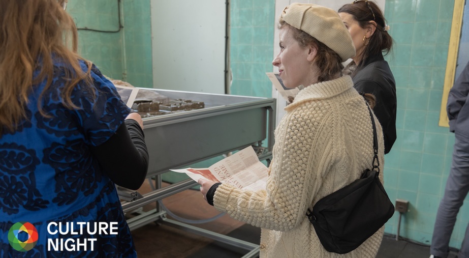 Culture Night 2024: ‘Longest Way Round, Shortest Way Home’ Exhibition Tours

Visitor at the opening of ‘Longest Way Round, Shortest Way Home’, Dublin Port. Photo: Maria Maarbjerg.