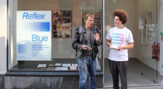 Two people stand in conversation outside Temple Bar Gallery + Studios.