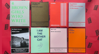 A picture of eight Rough Trade Books' publications which are laid out in two lines of four. The books are laid out on red paper with a repeat stamp-like pattern of a black book that reads Rough Trade Books in negative space on its front cover.