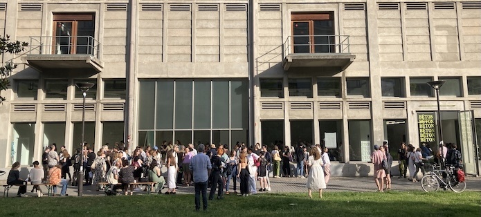 A group of artists stand outside Bétonsalon